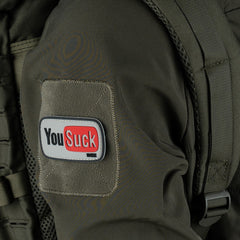 Embleem 3D PVC "You Suck" Alb/Negru - Atitudine Fără Compromis
